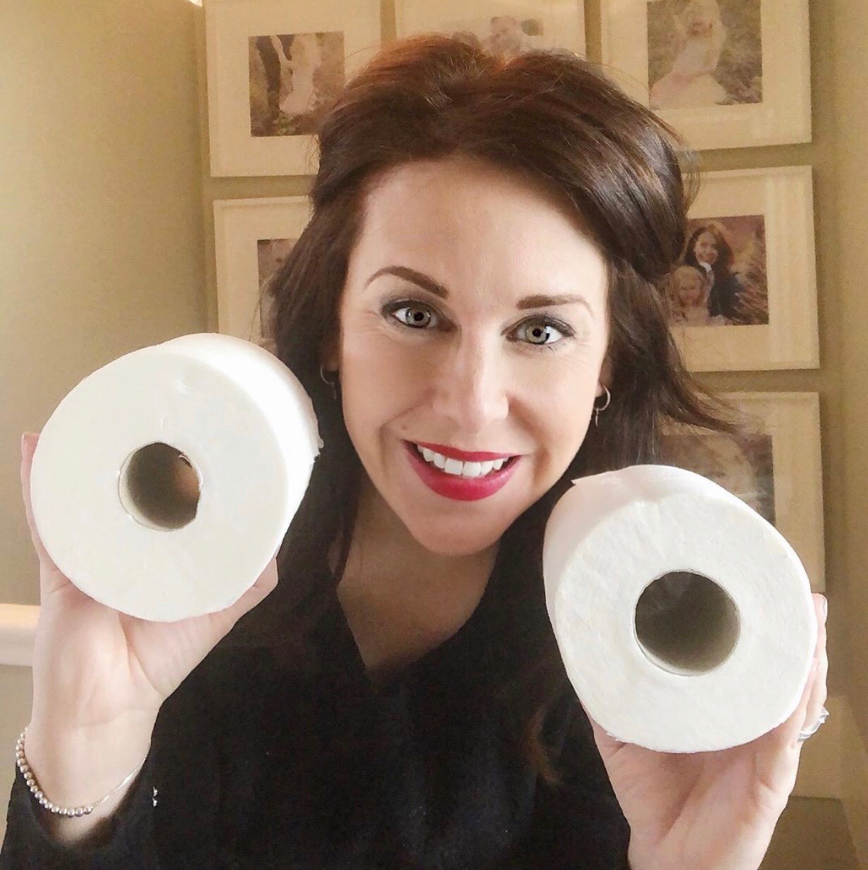 Kara Gammell holding toilet rolls